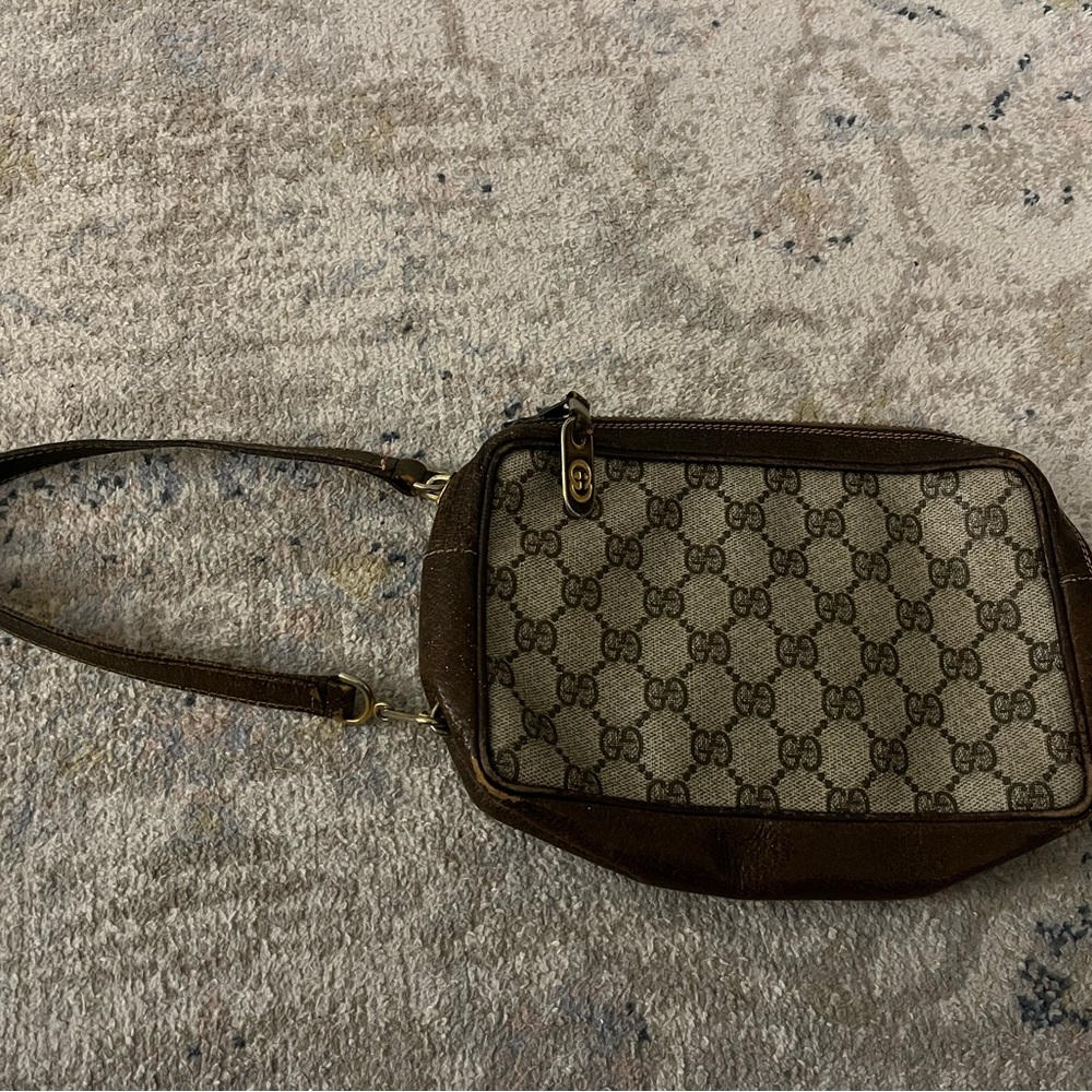 Gucci Monogrammed Clutch with Strap